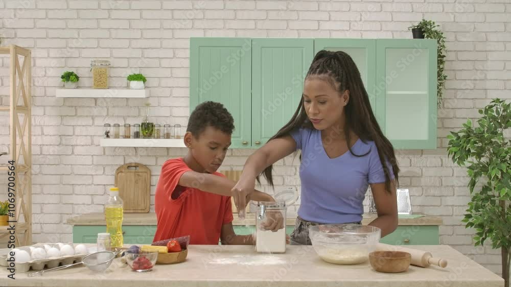 African American happy family preparing food in the kitchen. African American happy family preparing food in the kitchen.