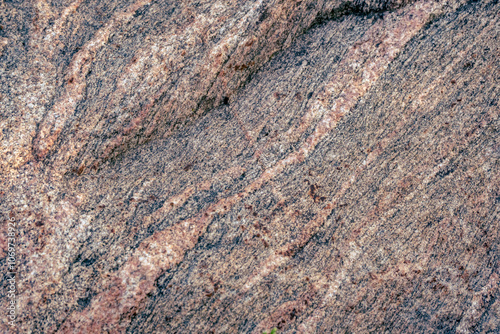 granite rock surface as natural background. Rough raw stone texture. Unique exclusive nature material. 