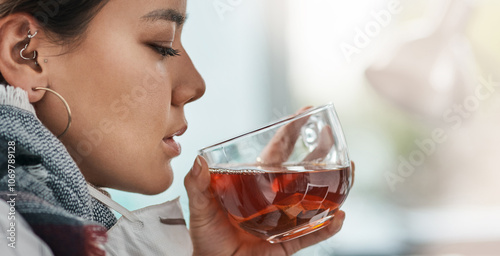 Sick, drinking and woman with tea, mask and liquid with herbs for illness, winter and cure in morning. Infection, thinking and person with mug, cold and girl with coffee, house and treatment for flu