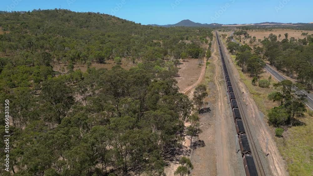 Forward moving aerial views over a coal train moving to words Gladstone, Central Queensland, Australia Forward moving aerial views over a coal train moving to words Gladstone, Central Queensland, Australia