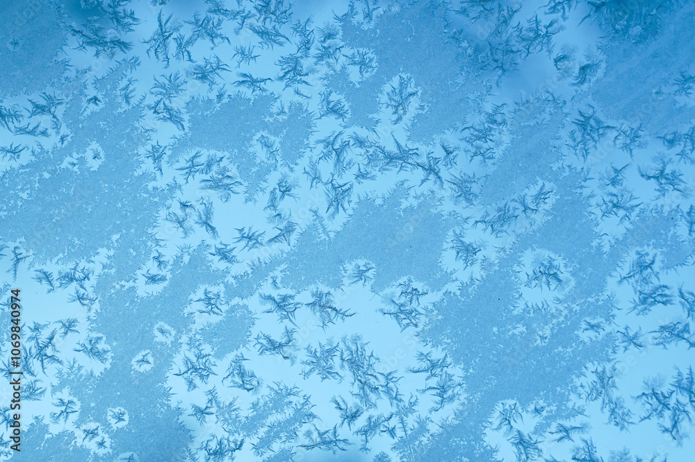 frost crystal on window glass in winter season