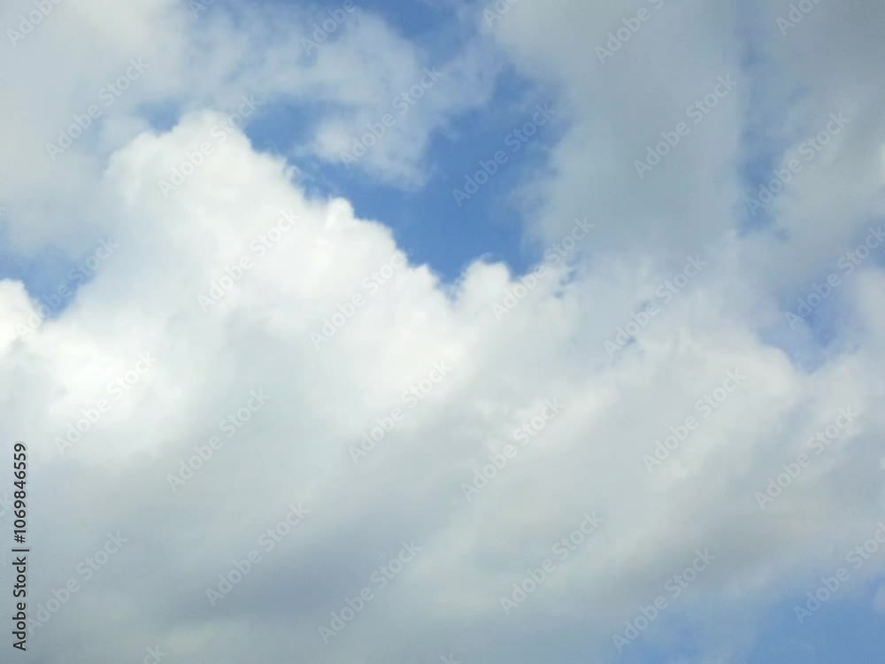 animated video of blue sky and white clouds during the day animated video of blue sky and white clouds during the day
