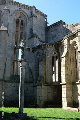 Historic stone church facade with cross