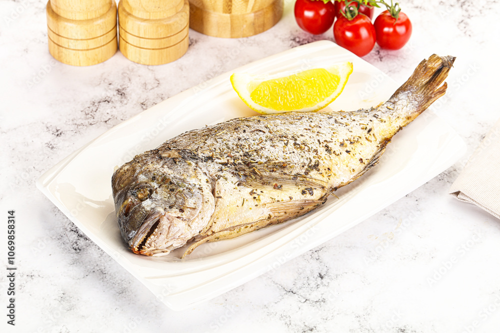 Baked Dorado fish served lemon Baked Dorado fish served lemon