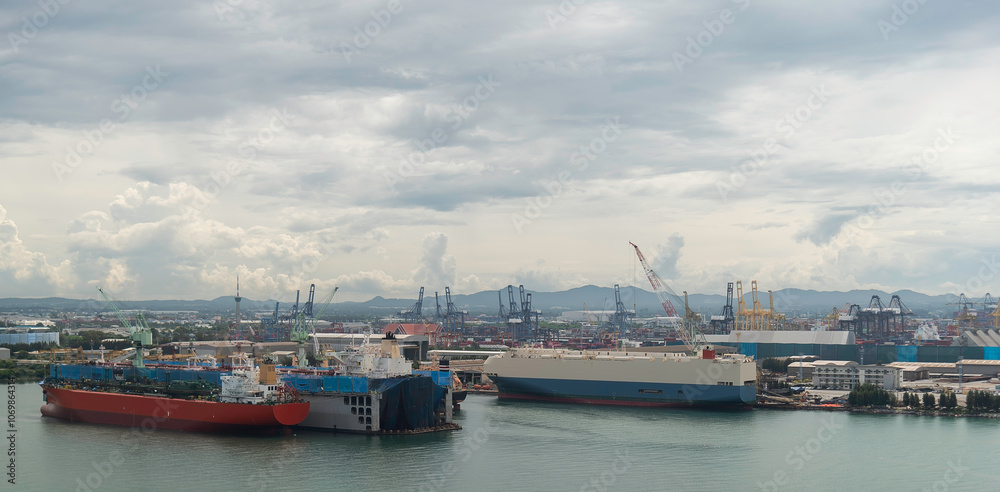 Fototapeta premium container ship commercial vessel alongside in port for loading and discharging containers services in maritime transports in World wide logistics
