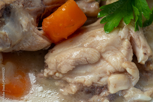 Obraz na płótnie Boiled chicken thighs with potatoes and carrots in a white plate. Boiled chicken meat. w salonie