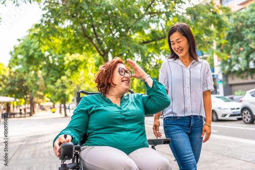 Bild auf Leinwand Woman with disability talking with chinese friends while walking outdoors