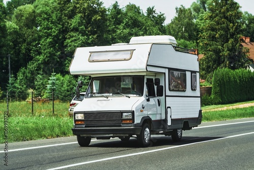 Family motorhome moving along quiet street