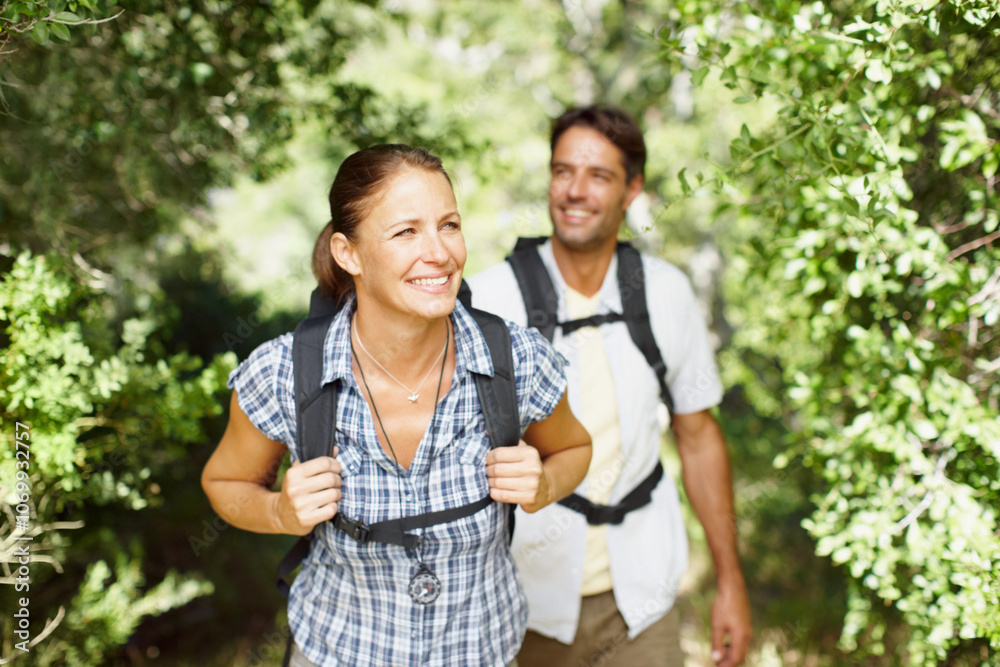 Couple, walking and smile in nature for hiking, fitness and adventure with bonding, love and support. Man, woman and forest outdoor for exercise, health or trekking with journey, travel and backpack Couple, walking and smile in nature for hiking, fitness and adventure with bonding, love and support. Man, woman and forest outdoor for exercise, health or trekking with journey, travel and backpack