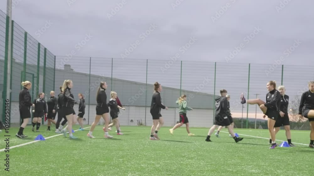 Female soccer teammates training drills, stretch exercises, slow-mo