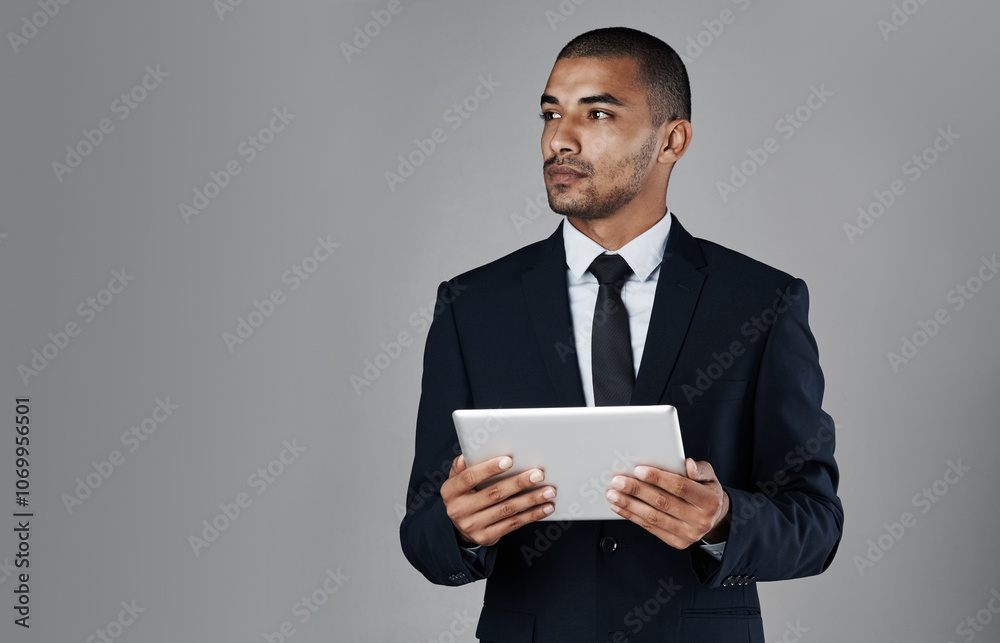 Businessman, trader and thinking with tablet in studio for profit, revenue or app on a gray background. Man, broker or investor with technology in wonder for return on investment or mockup space