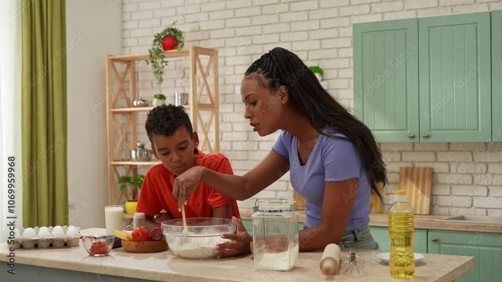 African American happy family preparing food in the kitchen. African American happy family preparing food in the kitchen.