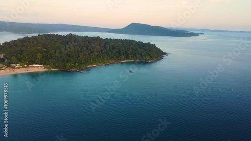 Aerial establishing overview of Koh Rong Sanloem island beach, with turquoise waters and scenic coastline near Sihanoukville photo