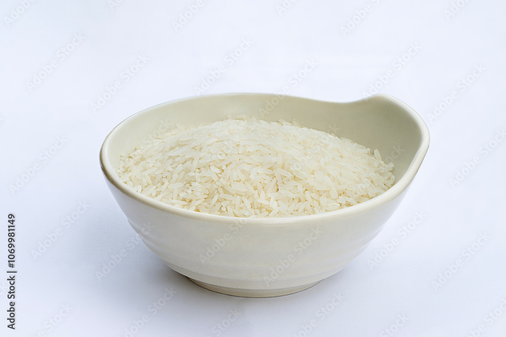 Asian short grain rice in white bowl . Uncooked rice or raw rice. Thai - Vietnam rice in white bowl isolated on white background. Asian short grain rice in white bowl . Uncooked rice or raw rice. Thai - Vietnam rice in white bowl isolated on white background.
