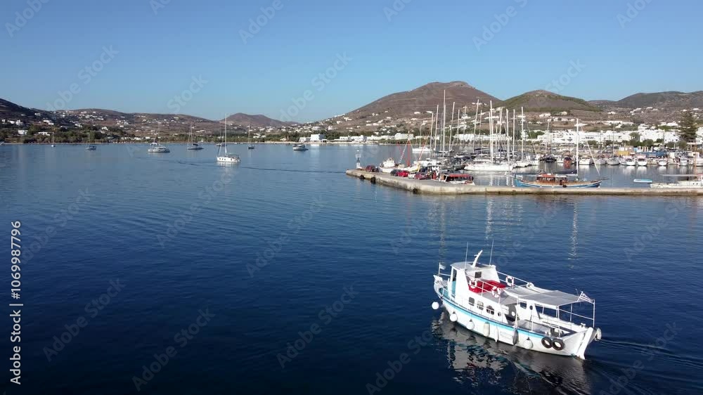Aerial over Touristic Tour Boat Leaving Parikia Port, Greece Aerial over Touristic Tour Boat Leaving Parikia Port, Greece
