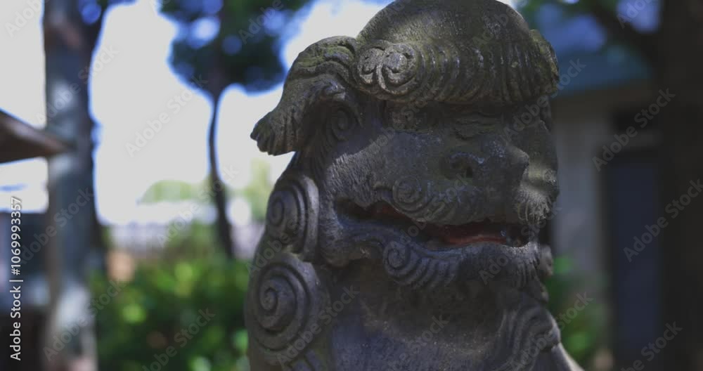 A statue of guardian dog KOMAINU at Nanasha shrine in Tokyo handheld shot A statue of guardian dog KOMAINU at Nanasha shrine in Tokyo handheld shot