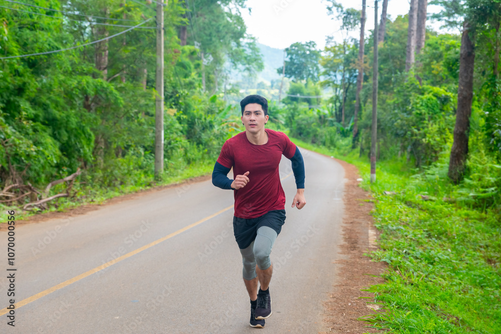 Asian man athlete in sportswear running on nature trail on the mountain. Healthy people enjoy outdoor active lifestyle travel natural park with sport training workout exercise on holiday vacation. Asian man athlete in sportswear running on nature trail on the mountain. Healthy people enjoy outdoor active lifestyle travel natural park with sport training workout exercise on holiday vacation.