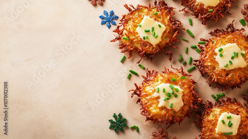 Latkes with melted butter drizzle and chives on a soft beige background, surrounded by miniature dreidels and festive accents photo