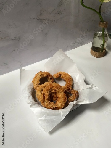 Homemade thick onion rings that are delicious for snacking at home photo