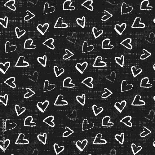 A seamless  pattern of various hand-drawn white hearts tossed on a black background