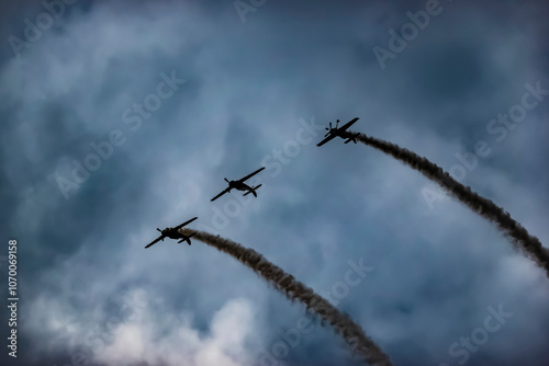 A pilot flies an aerobatic propeller plane in the sky