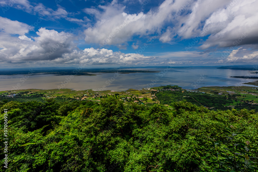 Natural background of clear sky, amidst the blue sky at the viewpoint, there are trees, sun, water retention dam, a nature stop for tourists. Natural background of clear sky, amidst the blue sky at the viewpoint, there are trees, sun, water retention dam, a nature stop for tourists.