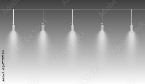 Row of white spotlights hanging from a track. Soft glow illuminating downward, creating a modern lighting effect. Ideal for stage lighting, exhibitions, and interior designs. Stage light