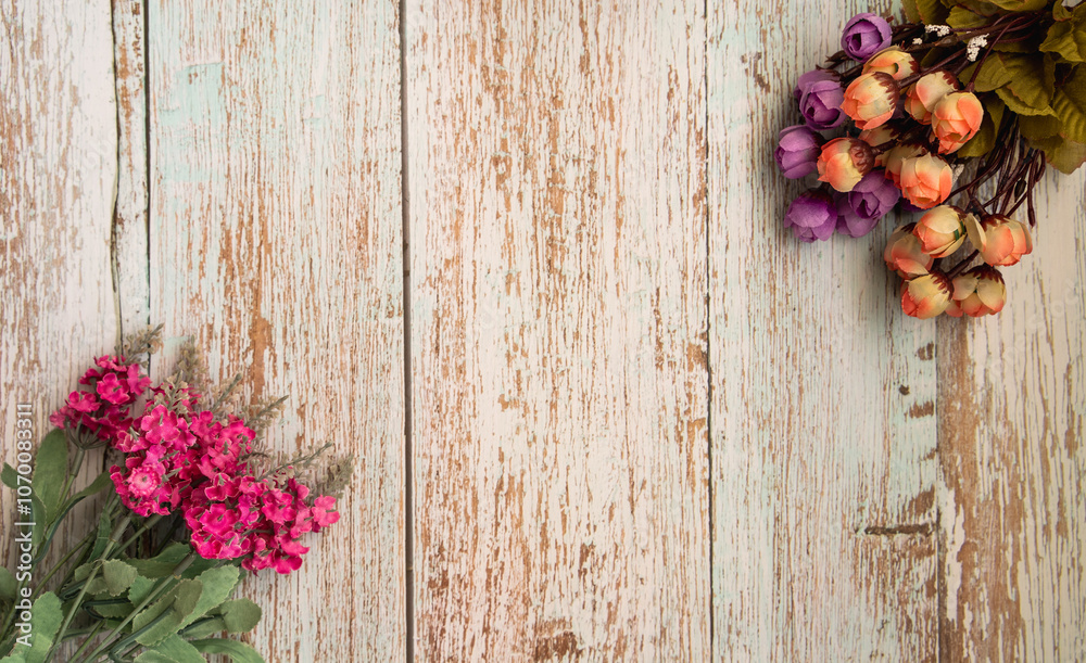Flowers on wooden table. Background for congratulatory messages for Mother's Day, Valentine's Day and special days. Greeting card with flowers on table. Flowers on wooden table. Background for congratulatory messages for Mother's Day, Valentine's Day and special days. Greeting card with flowers on table.