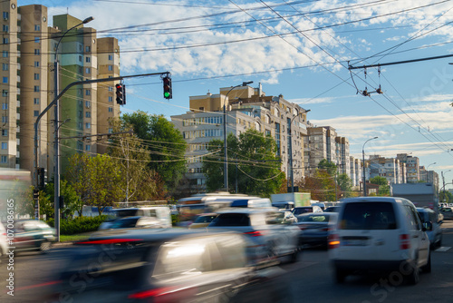 City street view, road, cars and heavy traffic, urban architecture during the day, Chisinau, Moldova