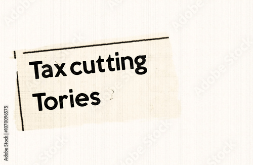 Tax-cutting Tories - current breaking daily news story communication copy newspaper headline article title in UK 2023 in sepia