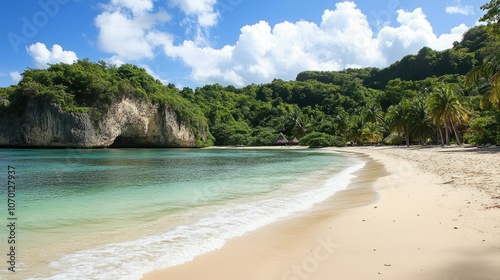 Warm, sunny day on a secluded beach with pristine sand and gently rolling waves on crystal-clear water.