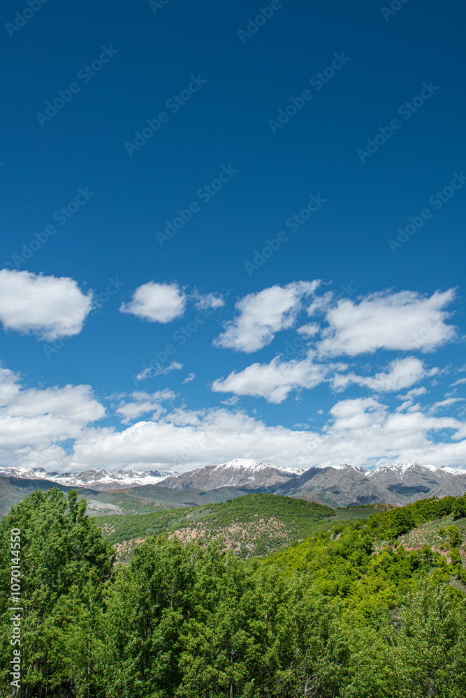 Green plains, snowy mountains. Blue sky and snowy mountains. Snowy mountains of Tunceli. Pülümür Valley, Buyer Mountain, Sarıgül Plateau, Buyer Waterfall.Munzur, Tunceli, Türkiye.
Green plains, snowy mountains. Blue sky and snowy mountains. Snowy mountains of Tunceli. Pülümür Valley, Buyer Mountain, Sarıgül Plateau, Buyer Waterfall.Munzur, Tunceli, Türkiye.