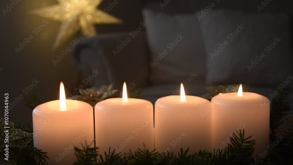 Four Advent candles are burning.