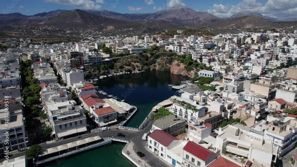 Pull back aerial shot of Lake Voulismeni in Agios Nikolaos, Crete, Greece Pull back aerial shot of Lake Voulismeni in Agios Nikolaos, Crete, Greece