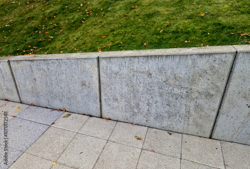 ugly holding a road notch of a bridge forecourt tunnel. retaining wall with concrete grouting is covered with fake, optically prettier wall. fencing with hollow bricks filled with wires, railing,steel