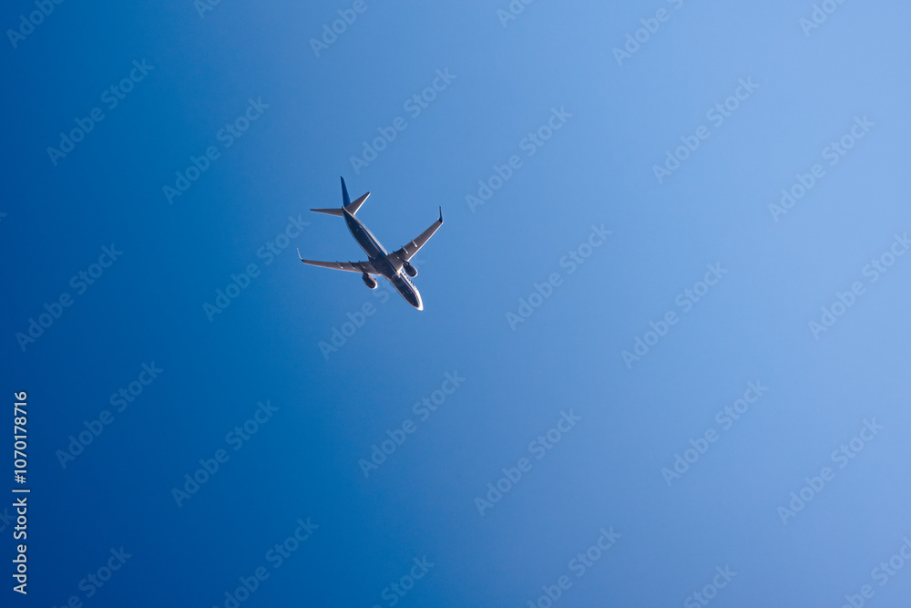 flying plane against the blue sky flying plane against the blue sky