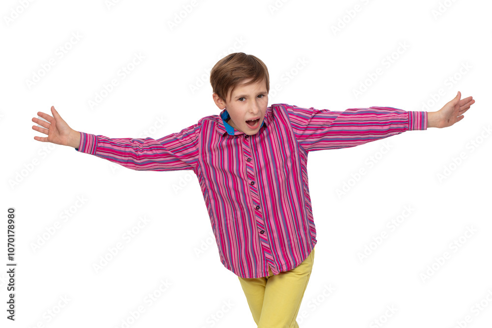 Teenage boy in striped shirt spreads arms and screams. Child on white background. Teenage boy in striped shirt spreads arms and screams. Child on white background.