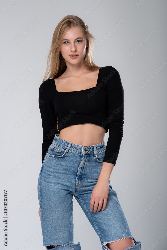 portrait of young beautiful blonde girl posing in jeans, studio isolated on white background portrait of young beautiful blonde girl posing in jeans, studio isolated on white background