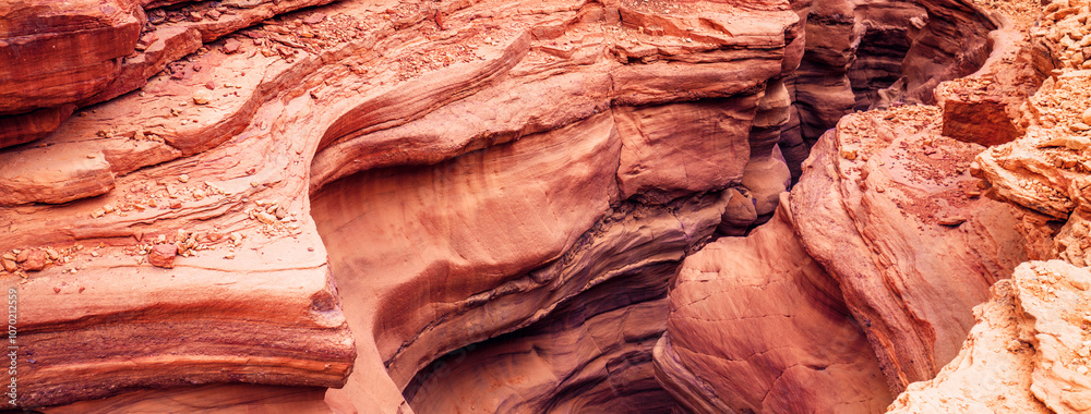 Desert nature landscape. Stone texture. Red canyon in the desert. Abstract stone nature background. Israel. Desert nature landscape. Stone texture. Horizontal banner