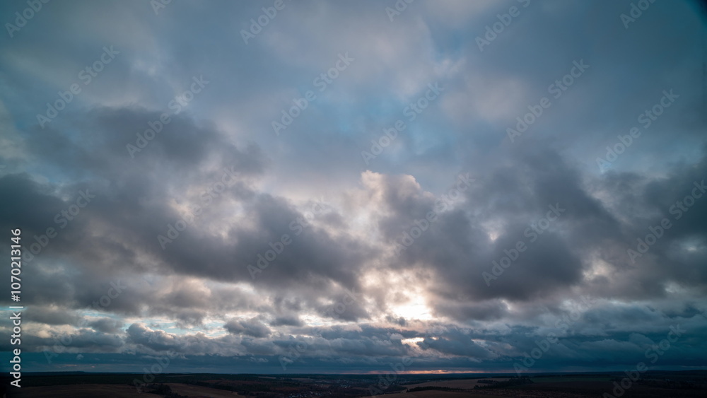Autumn Drift: Gentle Cumulus Clouds in the Warm Glow of Pre-Sunset Autumn Drift: Gentle Cumulus Clouds in the Warm Glow of Pre-Sunset