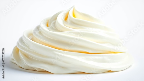 A smooth and creamy dollop of whipped topping on a white surface. The swirls of the topping create a soft and inviting texture.