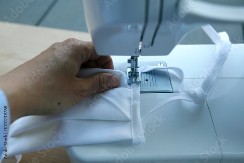 Hand on sewing machine