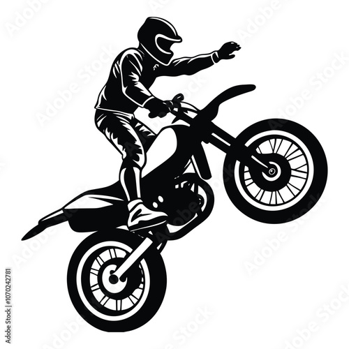 silhouette of a biker doing freestyle tricks