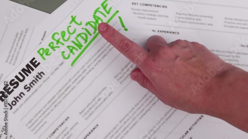 Fake mock CV (curriculum vitae) resume for John Smith, selected by HR as the perfect candidate for a job. Concept of job search, employee selection, recruitment process, work and hiring.
