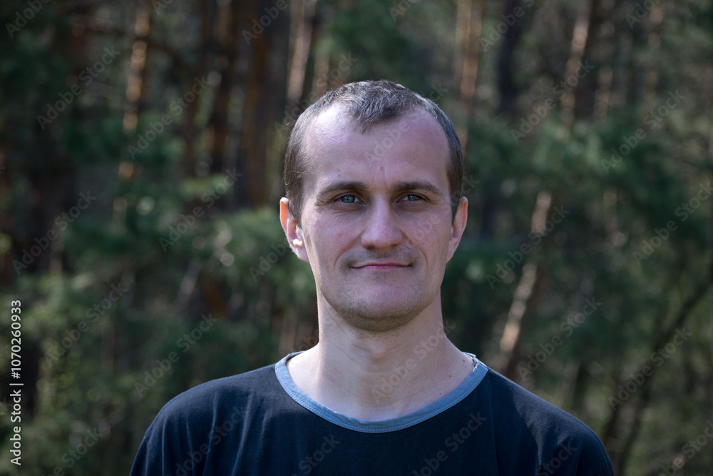Young European. man portrait. the guy against the backdrop of nature. photo, smiling, thoughtful, surprised, indignant, feelings, emotions. fair skin, slight stubble. man 30-40 years old. close-up