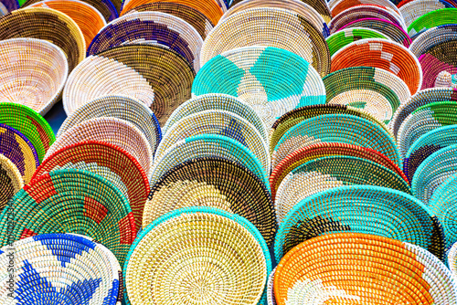 Obraz na plátně Alcudia Mallorca, Collection of handmade woven baskets featuring geometric patterns and beaded details
