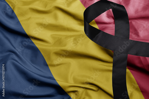 waving national flag of chad with black mourning ribbon .tragedy concept photo