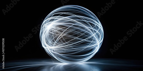 Abstract sphere of swirling white light trails on a black background photo