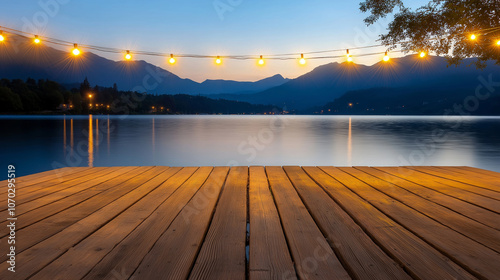 Tranquil scene of a wooden pier by a lake at dusk, string lights creating a warm glow against the backdrop of mountains photo