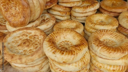 Kyrgyzstan, Osh City. A counter with traditionally painted bread cakes at the capital's central market. Traditional bread in Central Asia. Tandoor flatbread. Bread nan cakes. Traditional Kyrgyz bread.